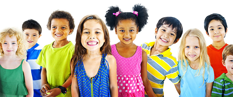 The image shows a group of diverse children posing together with bright smiles for a portrait.